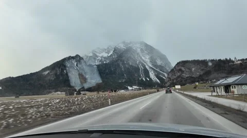 Slow Motion POV Tracking Shot Driving Through Majestic Austrian Mountains Vídeo Stock 328694885