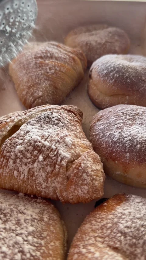 Slow Motion of Powdered Sugar Falling on Neapolitan Sfogliatelle Pastries Stock Footage 326661405