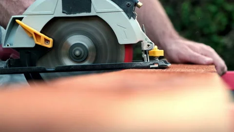 Slow Motion Power Tools, Round Electric Saw in Action Slices through Wood Stock Footage 146012823
