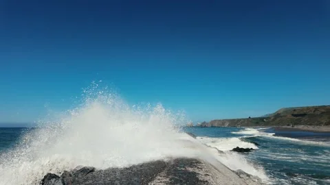 Slow Motion of a Powerful Ocean Wave Crashing Against the Jenner Sea Wall, Calif Stock Footage 319509623