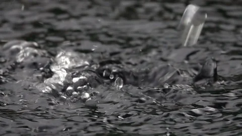 Slow motion of powerful waterfall on water surface and splash close up. Stock Footage 99146775