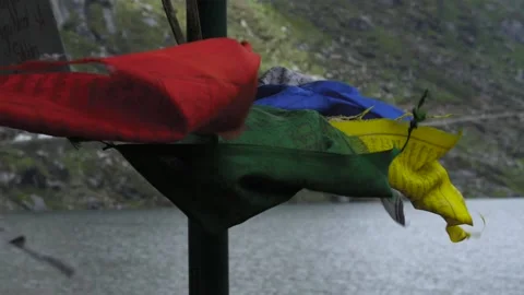Slow Motion Prayer Flags in front of Lake Stock Footage 139231694