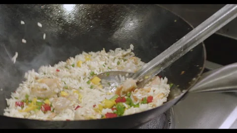 Slow-Motion Preparation of Gourmet Peruvian Shrimp Fried Rice Stock Footage 291314025