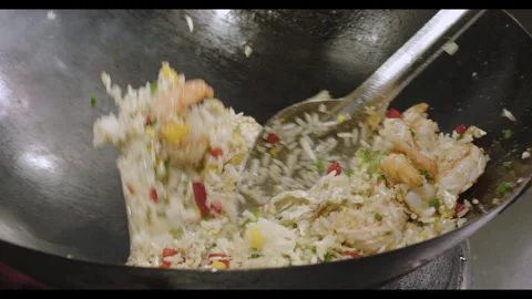 Slow-Motion Preparation of Gourmet Peruvian Shrimp Fried Rice Stock Footage 291314070