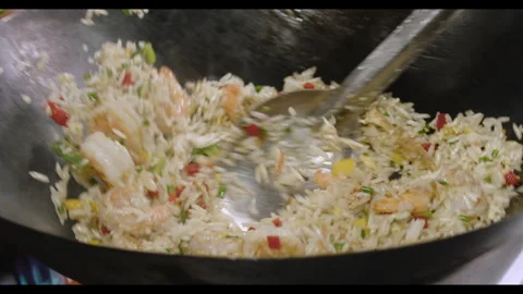 Slow-Motion Preparation of Gourmet Peruvian Shrimp Fried Rice Stock Footage 291314088