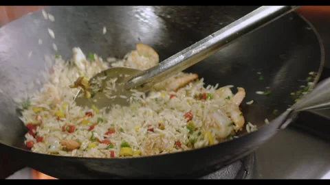 Slow-Motion Preparation of Gourmet Peruvian Shrimp Fried Rice Stock Footage 291314125