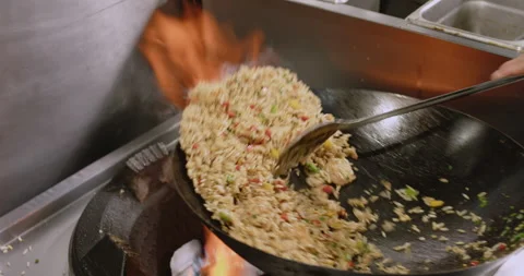 Slow-Motion Preparation of Gourmet Peruvian Shrimp Fried Rice Stock Footage 291314248