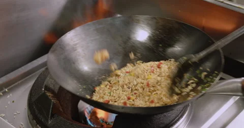 Slow-Motion Preparation of Gourmet Peruvian Shrimp Fried Rice Stock Footage 291314278