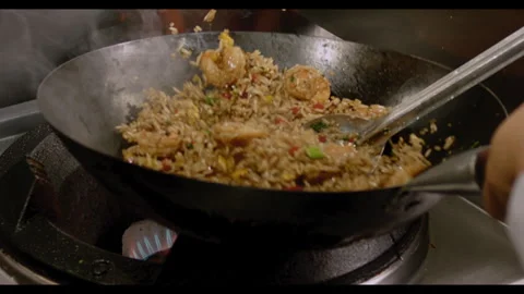 Slow-Motion Preparation of Gourmet Peruvian Shrimp Fried Rice Stock Footage 291314302