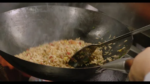 Slow-Motion Preparation of Gourmet Peruvian Shrimp Fried Rice Stock Footage 291314322