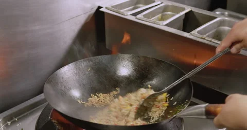 Slow-Motion Preparation of Gourmet Peruvian Shrimp Fried Rice Stock Footage 291314348