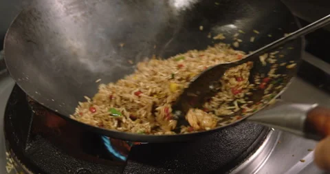 Slow-Motion Preparation of Gourmet Peruvian Shrimp Fried Rice Stock Footage 291314424