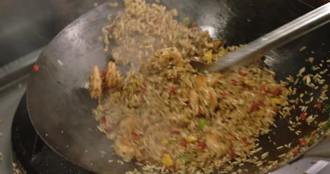 Slow-Motion Preparation of Gourmet Peruvian Shrimp Fried Rice Stock Footage 291314440