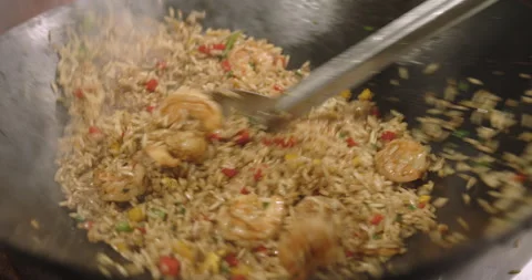 Slow-Motion Preparation of Gourmet Peruvian Shrimp Fried Rice Stock Footage 291314442