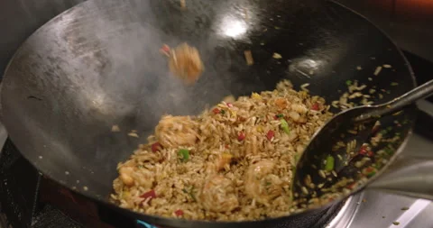 Slow-Motion Preparation of Gourmet Peruvian Shrimp Fried Rice Stock Footage 291314473