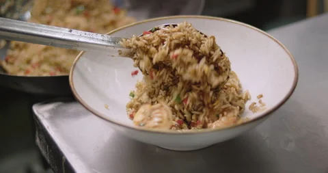 Slow-Motion Preparation of Gourmet Peruvian Shrimp Fried Rice Stock Footage 291314493