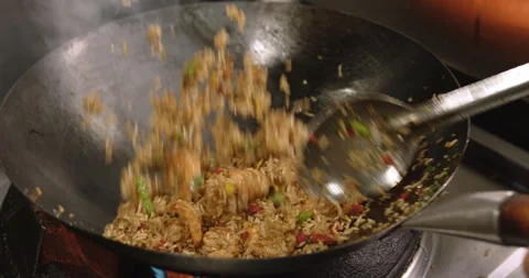 Slow-Motion Preparation of Gourmet Peruvian Shrimp Fried Rice Stock Footage 291314507