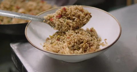 Slow-Motion Preparation of Gourmet Peruvian Shrimp Fried Rice Stock Footage 291314535