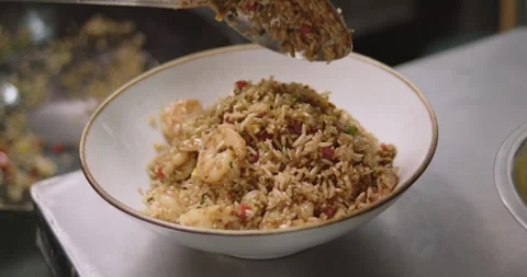 Slow-Motion Preparation of Gourmet Peruvian Shrimp Fried Rice Stock Footage 291314596