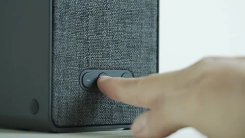 Slow motion pressing button on wireless speaker 4K video Video stock 172033007