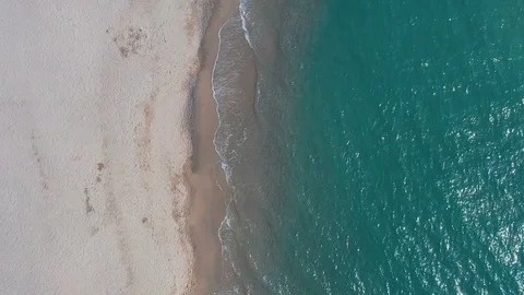 Slow-motion pristine tropical beach aerial top down 3 Stock Footage 112714338