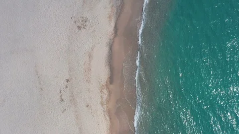 Slow-motion pristine tropical beach aerial top down 4 Stock Footage 112714475