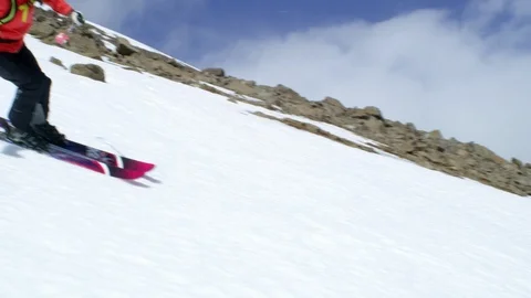 Slow Motion of pro skier in red suit freeriding in Iceland Stock Footage 124228201