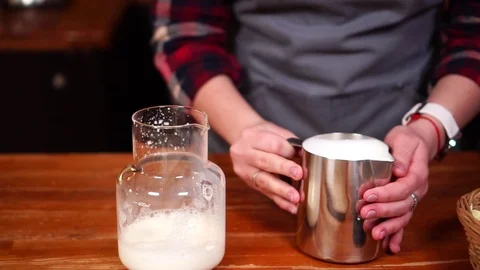 Slow motion process view on female barista working with milk making delicious Stock Footage 104541315