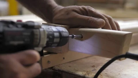 Slow motion. A professional carpenter takes a close-up of the details of Stock Footage 232290513