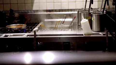 Slow Motion Professional kitchen, deep fryer, burner with pan NYC 4k Stock Footage 255755589