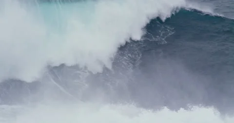 Slow motion of professional surfer getting lost in foamy ocean while surfing Stock Footage 156121112