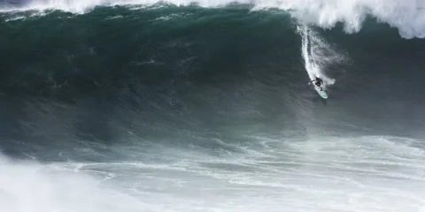 Slow motion of professional surfer riding on huge ocean waves with skill Stock Footage 163343145