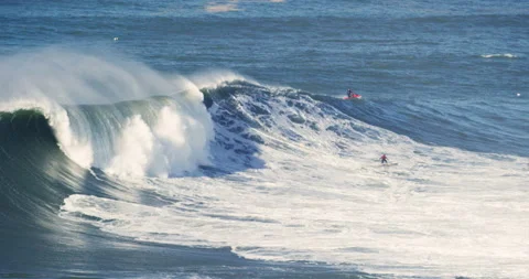 Slow motion of professional surfer surfing away from huge ocean wave skillfully Stock Footage 155802844