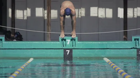 Slow Motion Of Professional Swimmer Jumping Off The Starting Block Stock Footage 34165541