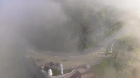 Slow Motion Pullback Above a Foggy Winding Coastal Road Video stock 341745427