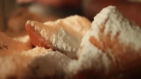 Slow motion pulling focus from one beignet to another. Stock Footage