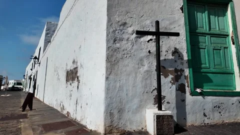 Slow motion push on a black cross against a white building, Teguise, Lanzarote Stock Footage 346376640