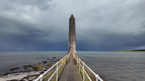 Slow motion push in Chaine Memorial Tower Larne dramatic sky 動画素材 316912982