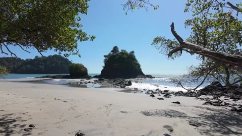 Slow motion push forward into stunning beach in Manuel Antonio Park, Costa Rica Stock Footage 302939053