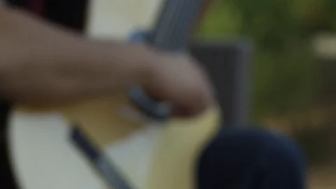 Slow Motion Push In On Guitar Playing Stock Footage 125964031
