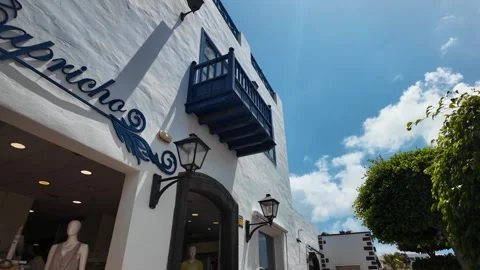 Slow motion push on white Capricho shop facade, Playa Blanca, Lanzarote Stock Footage 346376293