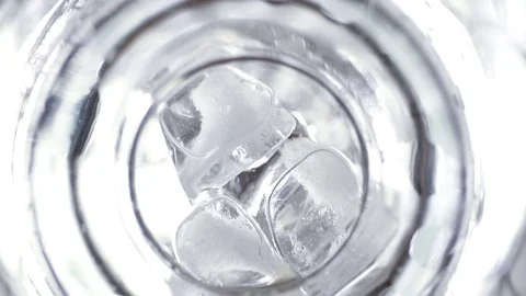 Slow motion, Put slice lemon, ice cubes into the glass and pouring soda water Stock Footage 78691922