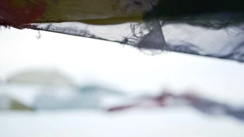 Slow motion rack focus between prayer flags in Nepal Stock Footage 91171559