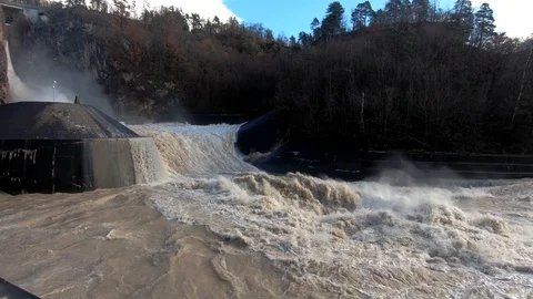 Slow motion raging flooded chaotic river water flowing in canal Stock Footage 121679438