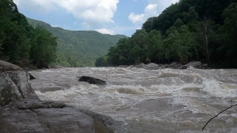 SLOW MOTION RAGING WHITE WATERS OF THE NEW RIVER GORGE Stock Footage 84236916