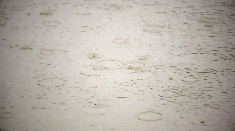 Slow motion of rain dropping on the sepia water surface with light vignette Stock Footage 52769511
