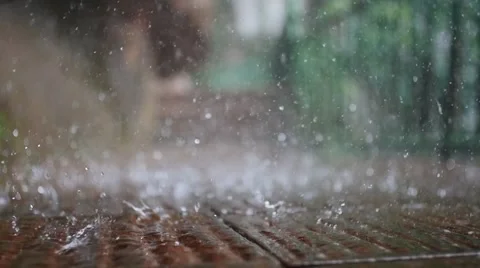 Slow motion rain drops closeup view.  Stock Footage 64411385