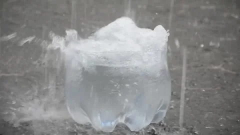 Slow motion - rain drops fall into the container Stock Footage 234428109