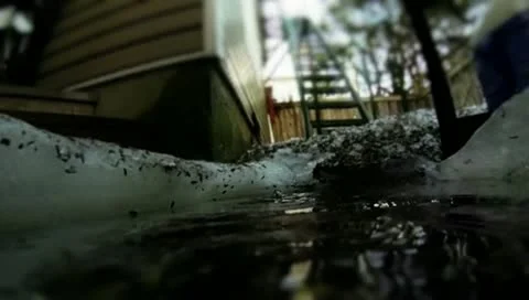 Slow motion rain drops in puddle Stock Footage 22261468