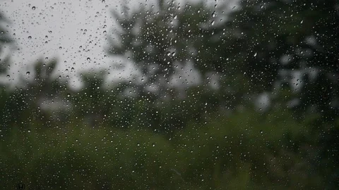 Slow motion, rain drops on window car with driving on road Stock Footage 96585947